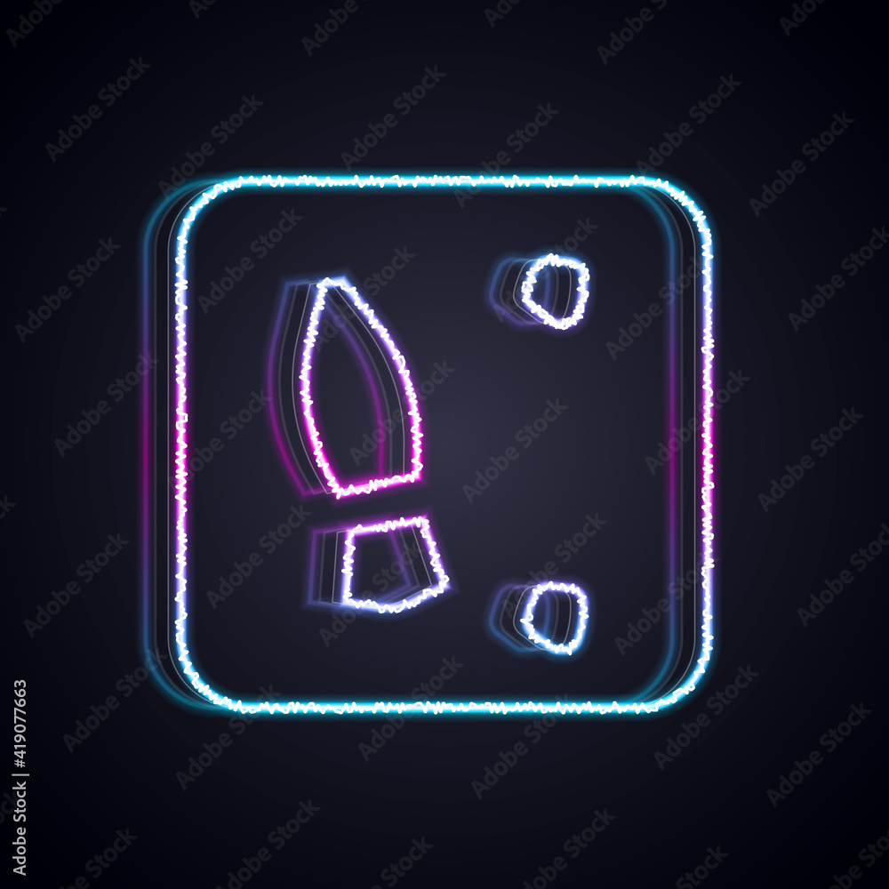 Glowing neon line Human footprints shoes icon isolated on black background. Shoes sole. Vector.