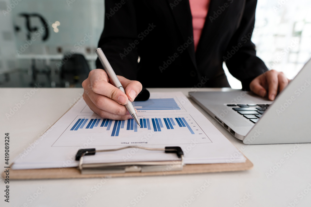 Business people working with graphs, business documents on their desks to analyze for business start