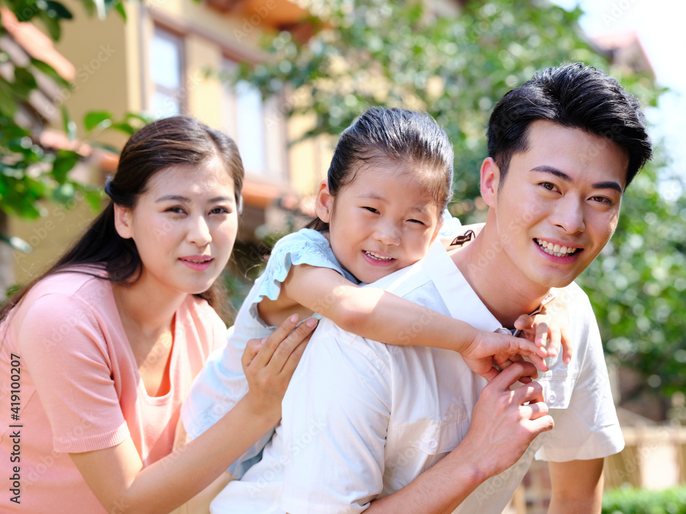 Happy family of three in the outdoor group photo