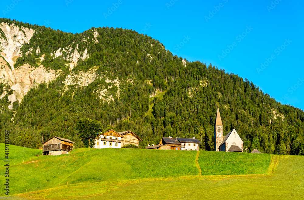 View of Val di Funes with the Chruch of Santa Maddalena in the Dolomites Mountains. UNESCO world her