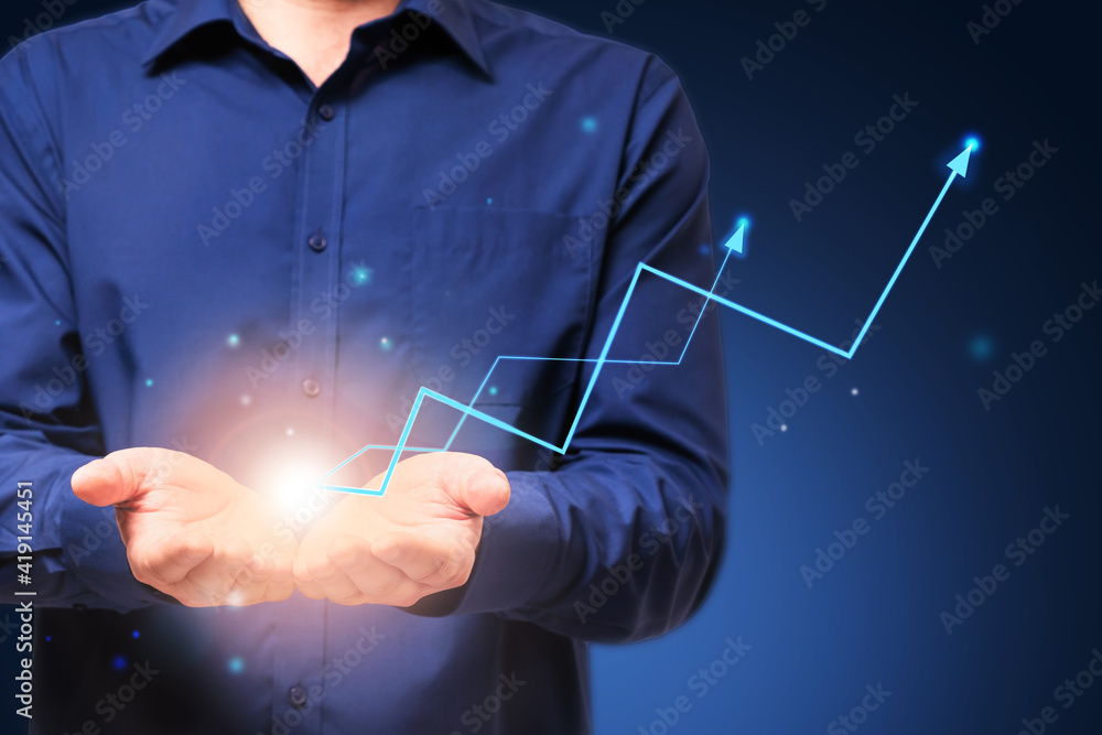 Increase in business profits concept with glowing light bulb in male hands and digital arrows up