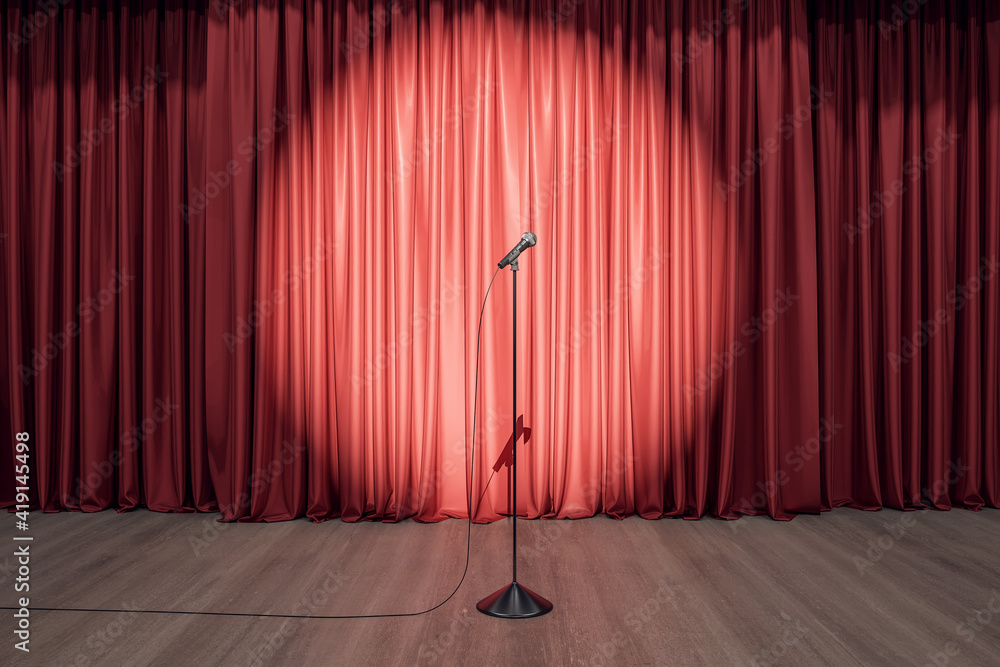 Speaker performance concept with round spotlight on red curtain and microphone on wooden floor of em