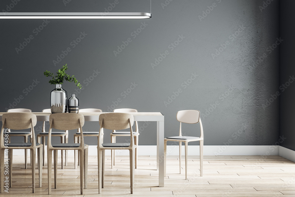 Spacious eco style dining room with wooden table, chairs and floor, black wall and modern chandelier