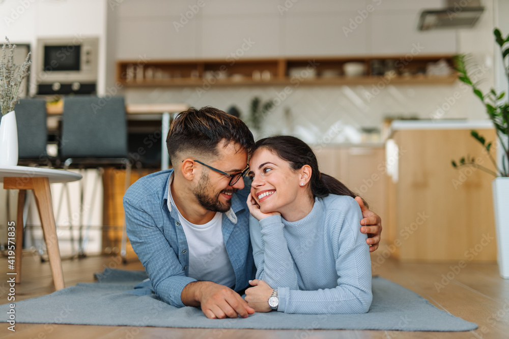 Man with glasses on, woman with wrist watch.