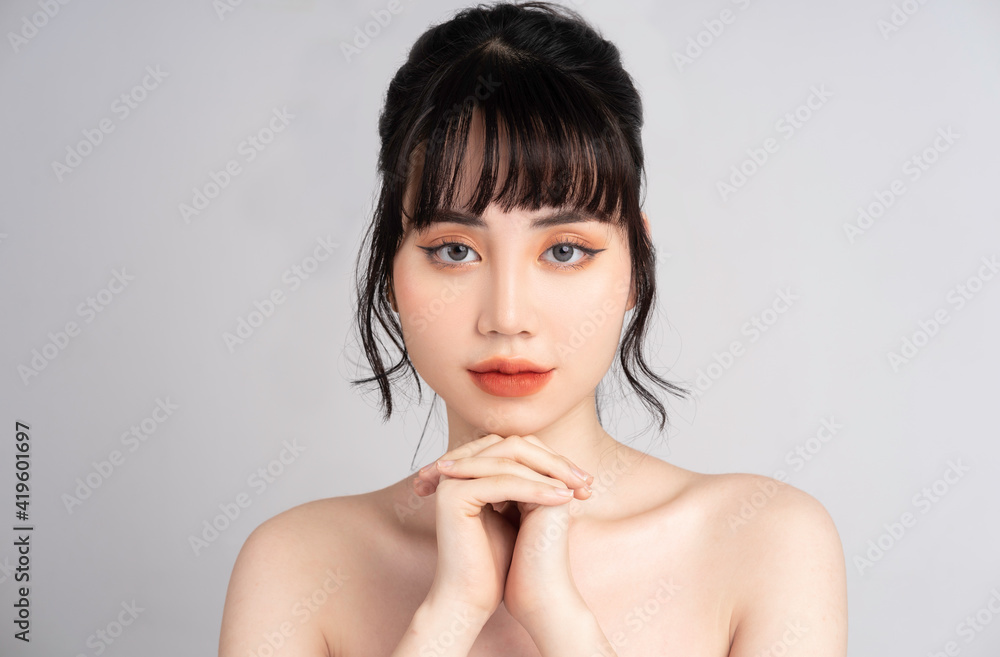 Portrait of young Asian woman with beautiful skin and smile