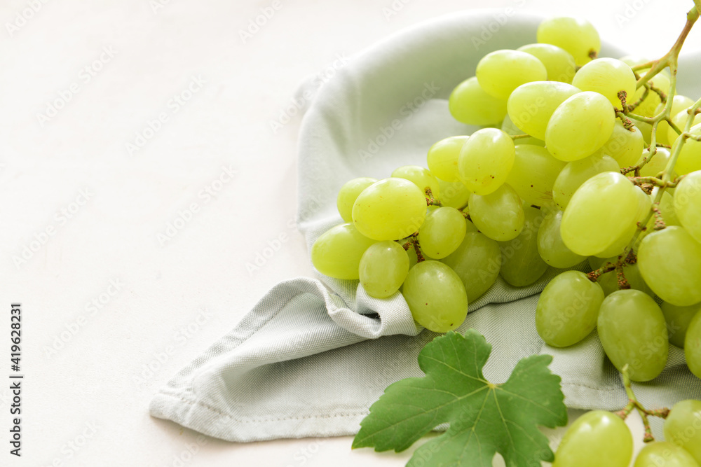 Ripe green grapes on white background