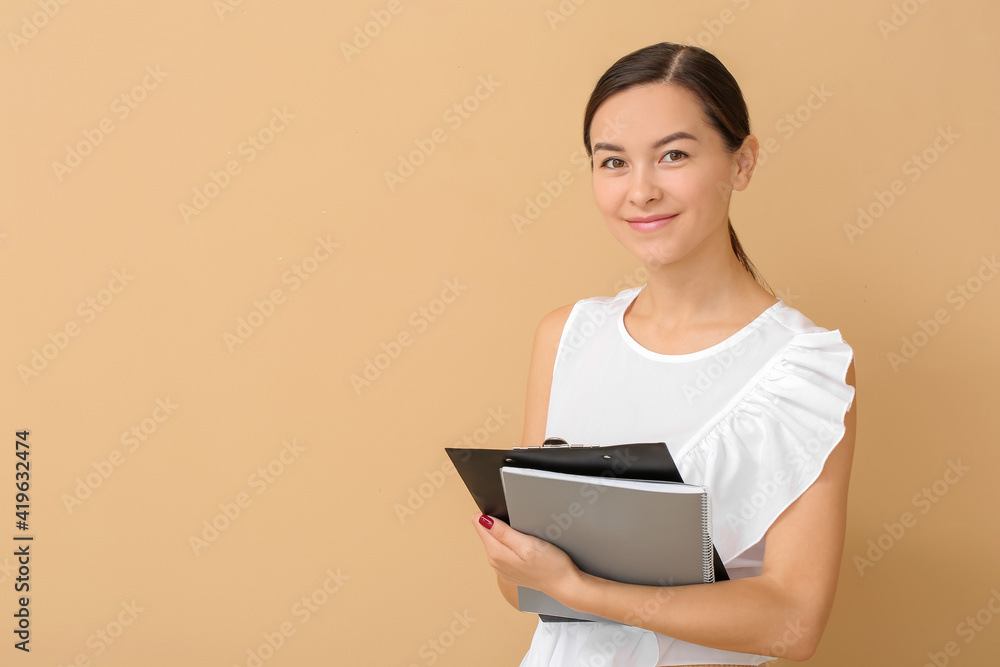 Portrait of female psychologist on color background