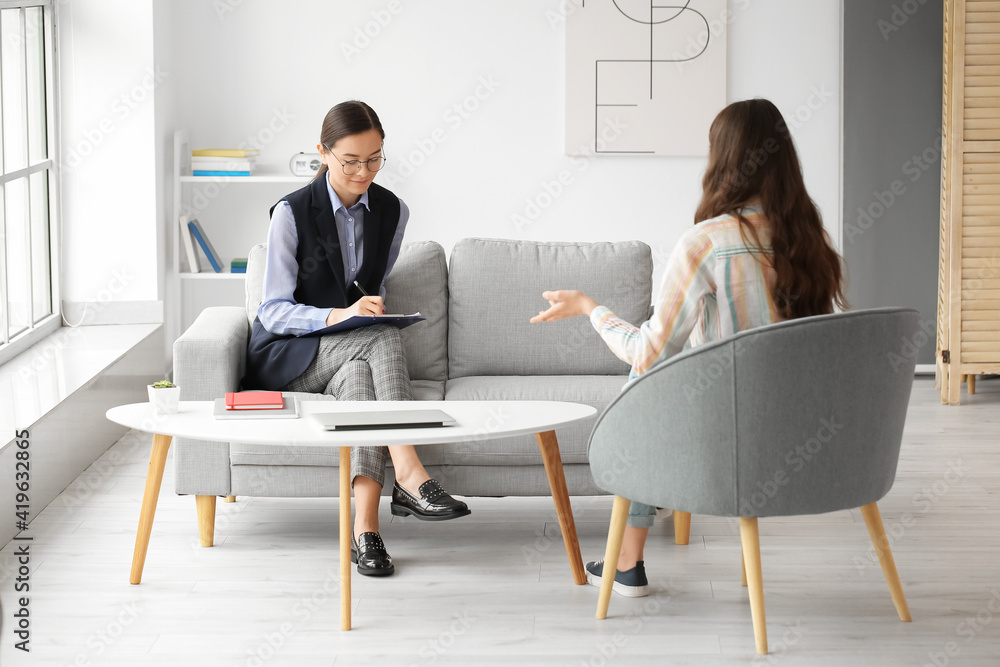 Female psychologist working with patient in office