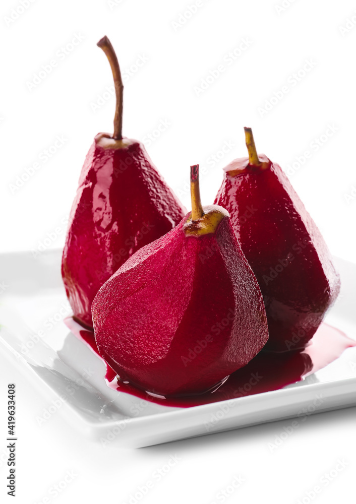 Plate of tasty poached pears in wine sauce on white background