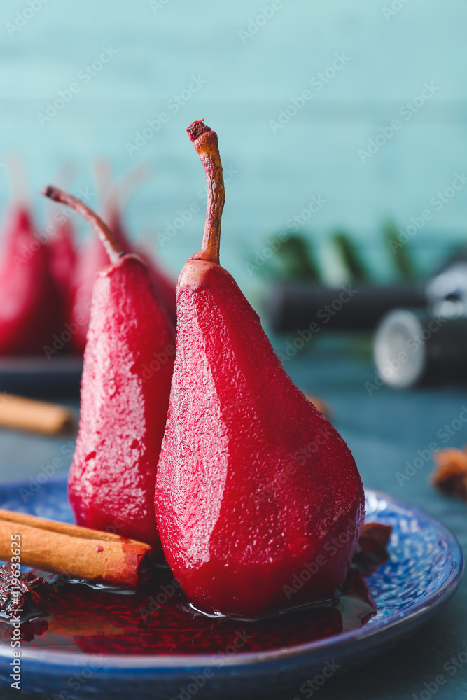 Plate of tasty poached pears in wine sauce, closeup