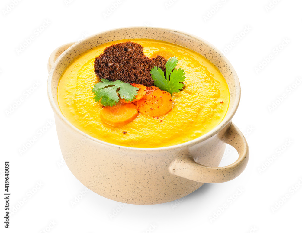 Cooking pot of tasty carrot cream soup on white background