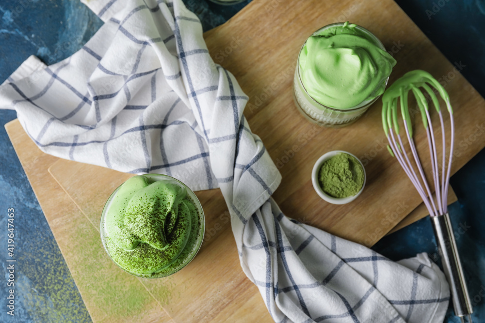 Composition with tasty dalgona matcha latte on table