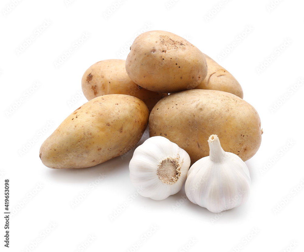 Potatoes and garlic on white background