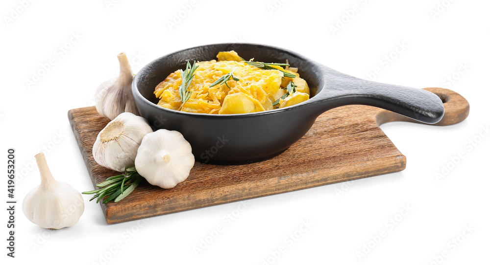 Frying pan of tasty potato with cheese and garlic on white background