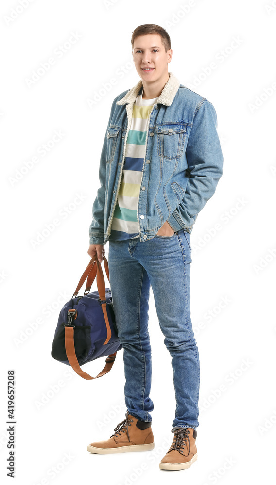 Handsome young man with bag on white background