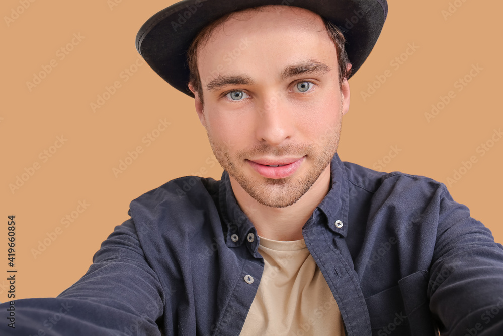 Handsome young man on color background, closeup