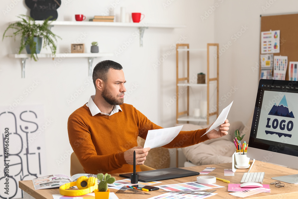 Male designer working in office