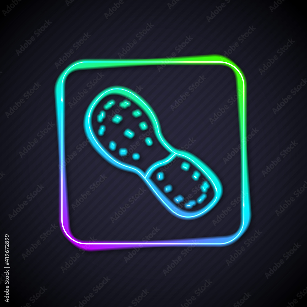 Glowing neon line Human footprints shoes icon isolated on black background. Shoes sole. Vector.