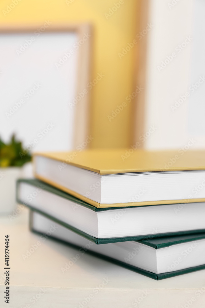 Stack of books on table, closeup