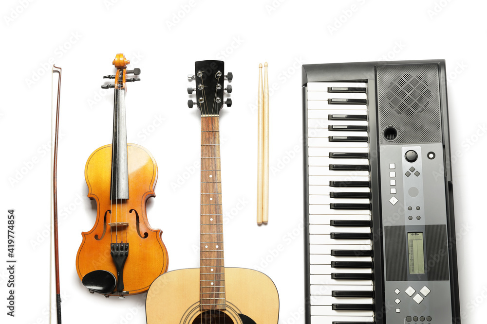 Different musical instruments on white background