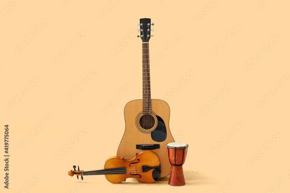 Different musical instruments on color background