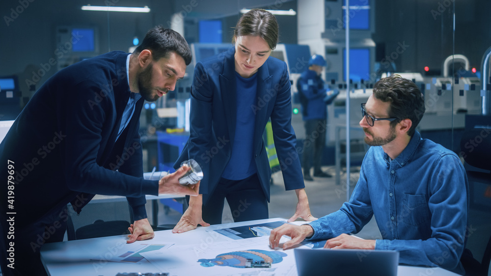 Modern Factory Office Meeting Room: Diverse Team of Engineers, Managers Talking at Conference Table,