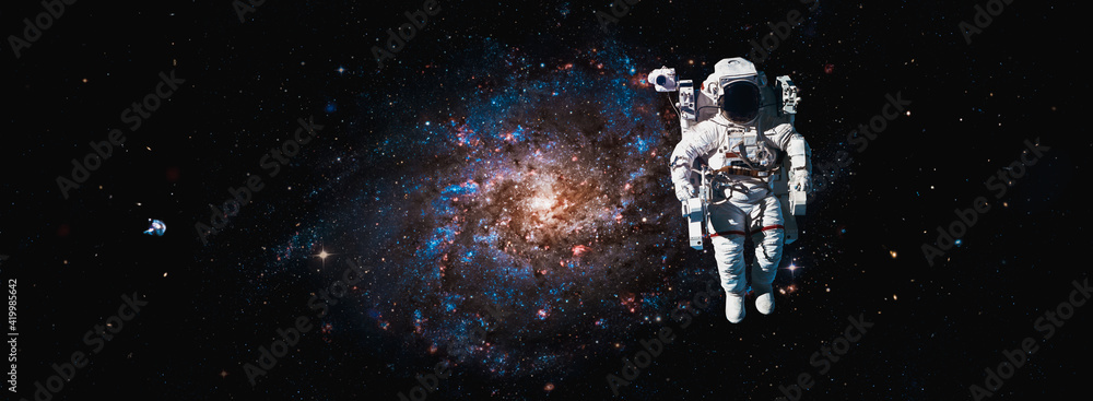 Astronaut spaceman do spacewalk while working for space station in outer space . Astronaut wear full