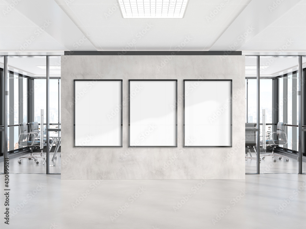 Three vertical frames Mockup hanging on wall. Mock up of billboards in modern concrete office interi