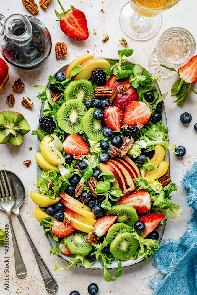 Healthy veggie and fruit salad flat lay topped with blueberries