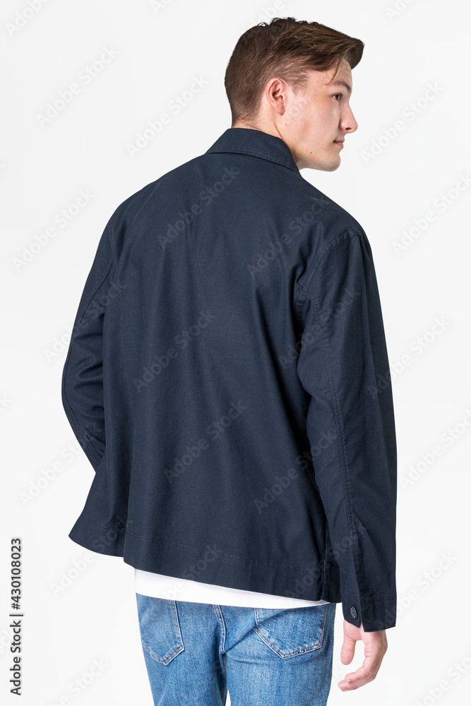 Man in navy jacket and jeans streetwear rear view