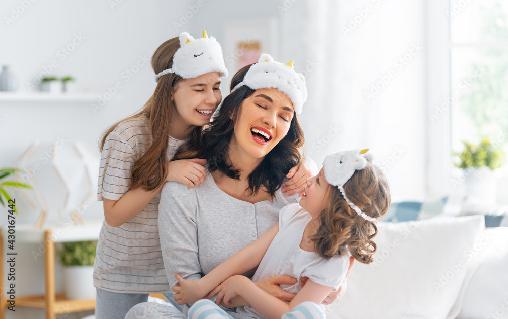 girls and their mother enjoying sunny morning