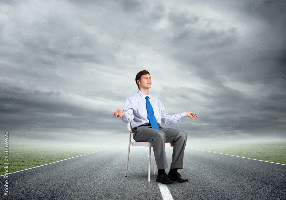 businessman meditates on office chair