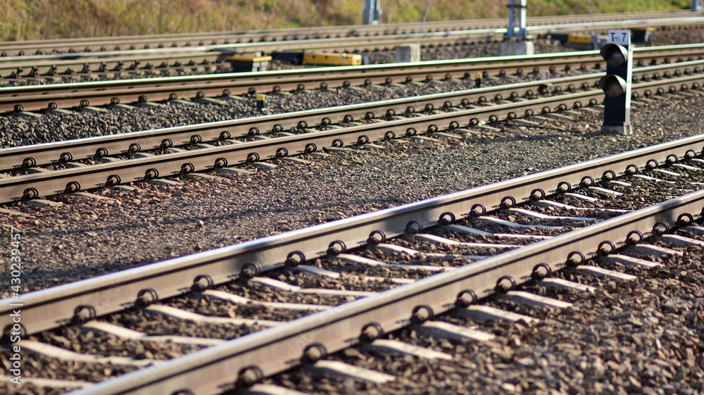 Railway tracks in a rural scene in a sunny day.