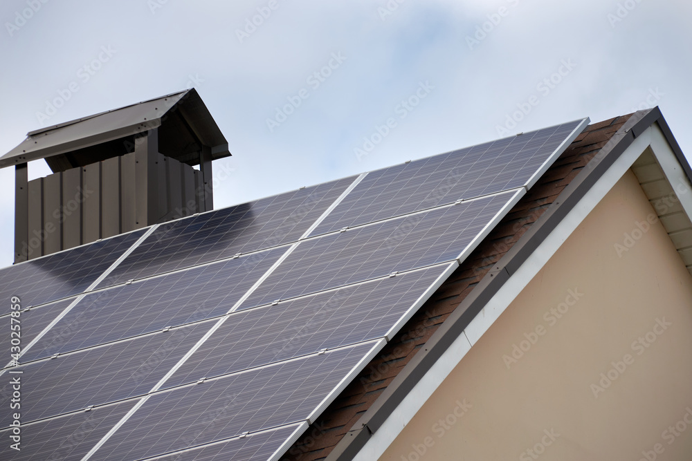 Solar panels on the roof of the house. Introduction of ecological technologies of electricity produc