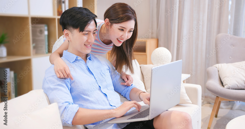 couple use laptop at home