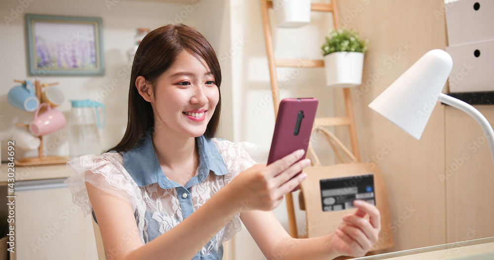 asian woman shopping by phone