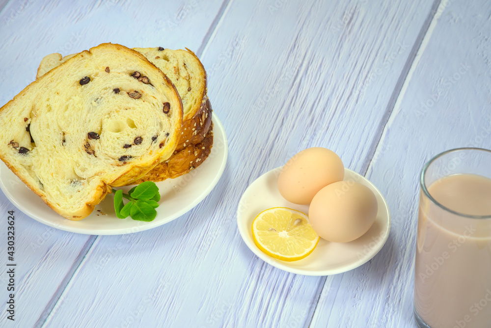 Delicious bread slices, boiled eggs, soy milk, nutritious breakfast