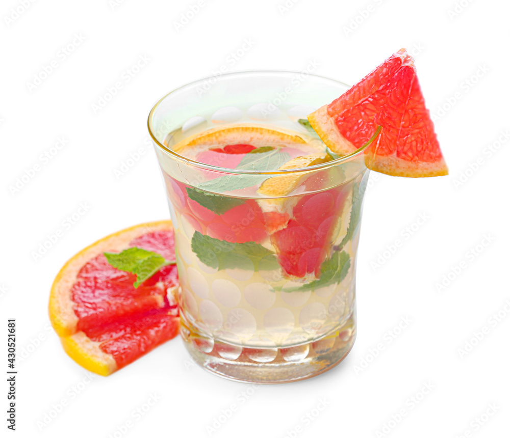 Glass of tasty grapefruit lemonade on white background