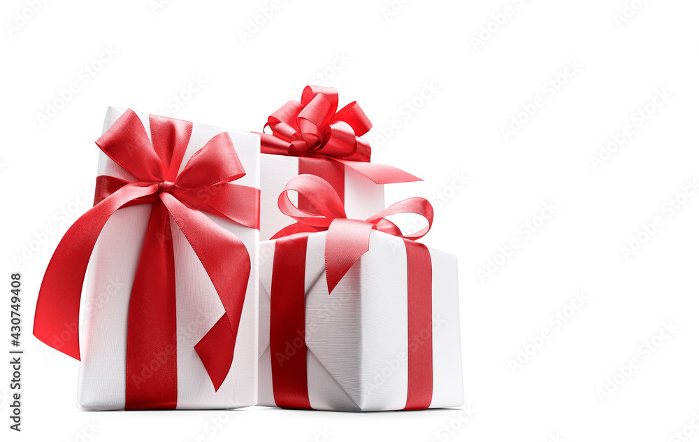 Low-angle shot of white color gift boxes with red bows isolated on white background - clipping path 