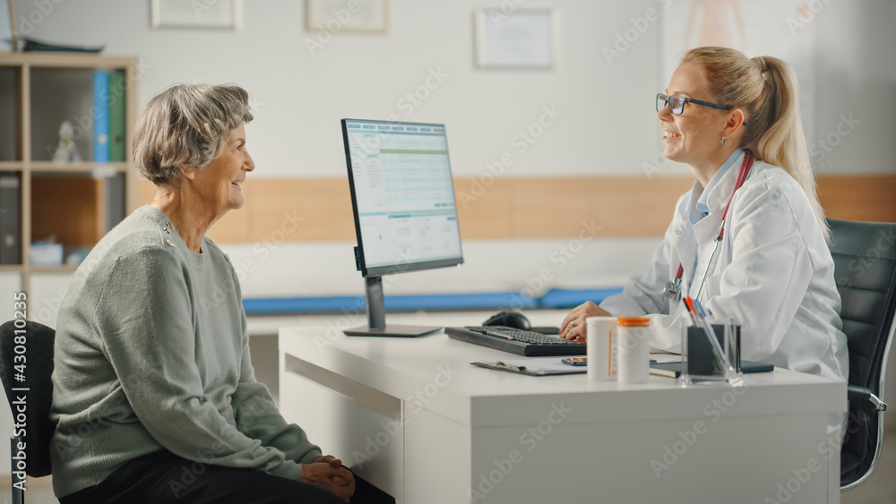 Female Family Doctor is Reading Medical History of Senior Patient and Speaking with Her During Consu