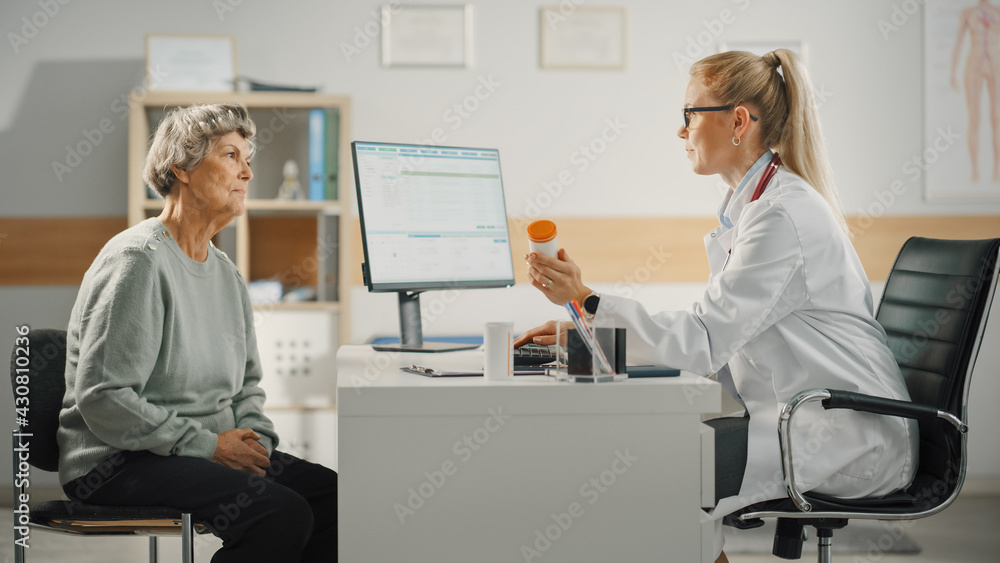 Female Family Doctor is Prescribing Treatment for Senior Patient and Speaking with Her During Consul