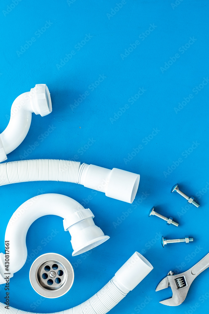 Professional instruments for plumber on blue background top view space for text