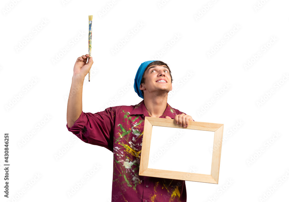 Young handsome painter artist holding paintbrush