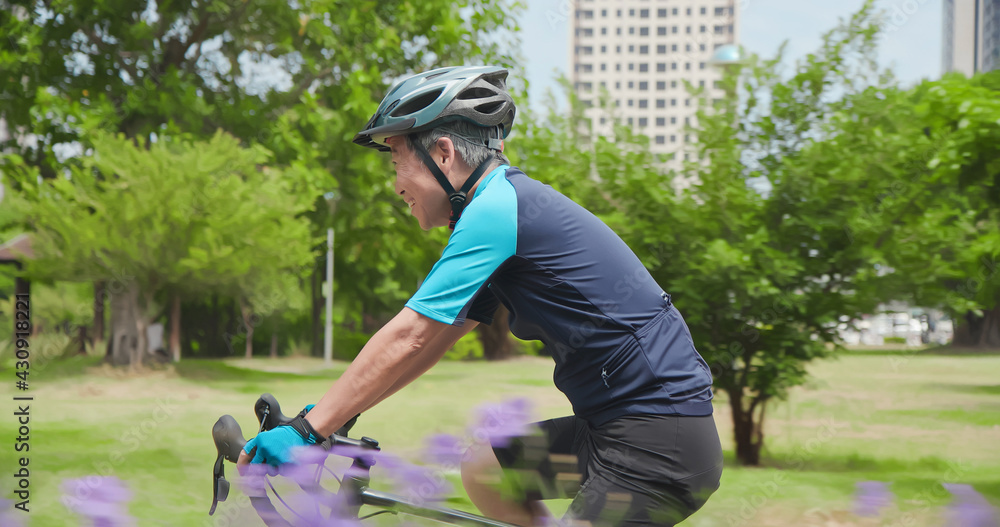 Asian old man cycling bicycle