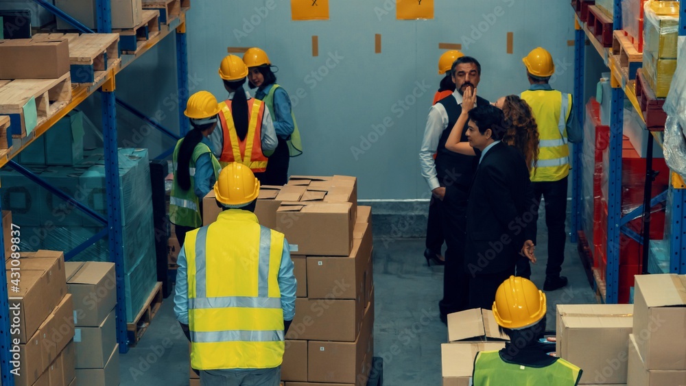 Many people , workers and manger work in warehouse or storehouse . Logistics , supply chain and ware