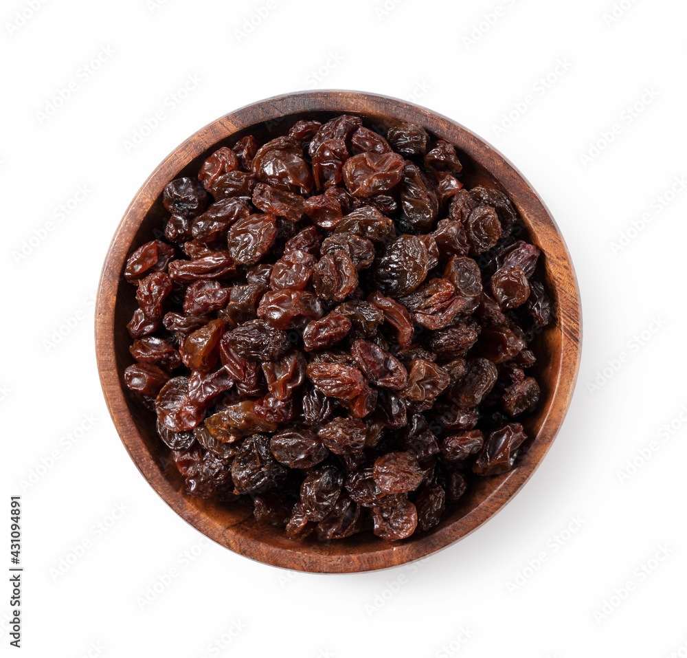 Raisins in a wooden bowl set against a white background.