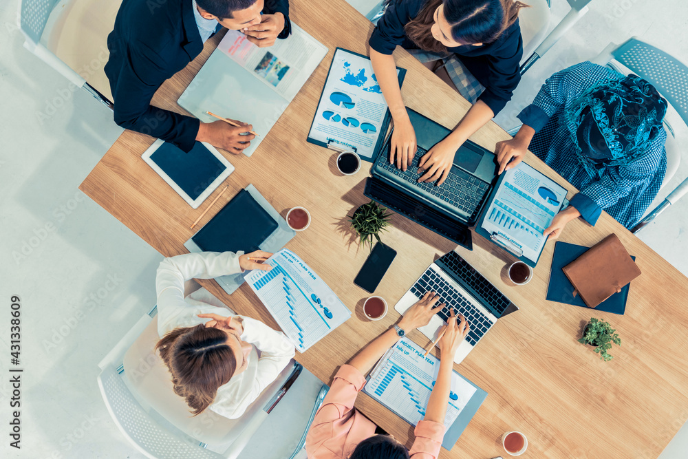 Top view of businessman executive in group meeting with other businessmen and businesswomen in moder