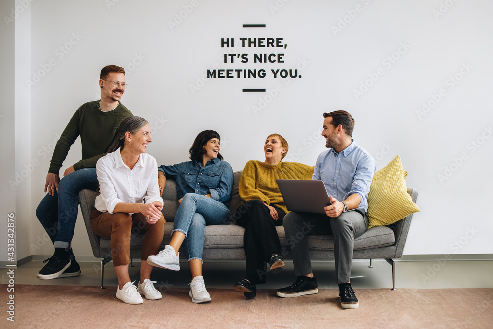 Team of professionals smiling in office lobby