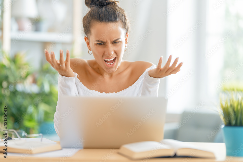 woman working on laptop at home.