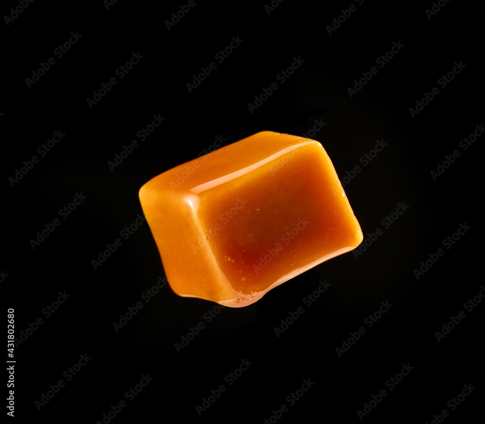 caramel candy on black background